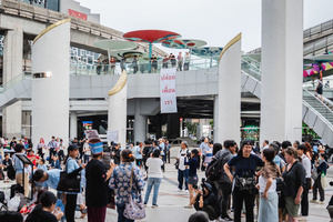 During the “People’s Amnesty” vigil, a banner hanging above the gathering reads “Release Our Friends” in Thai. People gathered outside Bangkok Art and Culture Centre for a candlelight vigil titled “Light Up Hope for the People’s Amnesty.” Organized ahead of a parliamentary debate on the 16 July 2025, the event featured personal testimonies, portraits of 50 political detainees, and a red rose display reading “Amnesty 112.” Participants called for the passage of a comprehensive amnesty bill covering cases under Section 112 of the Thai Criminal Code.
