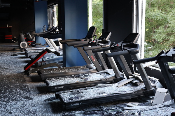 A view of a damaged sports hall following a drone attack in the Kiev district. As a result of the attack, more than 10 cars were burned down near a residential complex in Kiev district, a grocery store and a sports hall were damaged. According to the regional prosecutor's office, a 41-year-old local resident was injured in the attack with a mine-explosive injury and was hospitalized. Ten more were provided with psychological assistance.