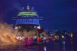 Extinction Rebellion climate activists in kayaks at pre-dawn attempt to block the path of Luxury Ocean liner the "Celebrity Eclipse" from docking at the Passages Terminal. A little before sunrise, climate activists from Extinction Rebellion, Netherlands attempted to block the path of Luxury Ocean liner the ‘Celebrity Eclipse’ from docking at the Passages Terminal in Amsterdam. The ‘Celebrity Eclipse’ is operated by Celebrity Cruises, a subsidiary of Royal Caribbean Group. The activists numbered 30 in all, with the majority in 2-person kayaks stating that "Cruise ships are floating environmental disasters. They should not be allowed in Dutch waters. We demand strict and binding national and international environmental standards and regulations, as well as strict enforcement and sanctions policy."