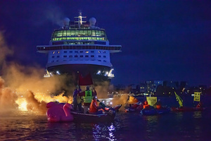 Extinction Rebellion climate activists in kayaks at pre-dawn attempt to block the path of Luxury Ocean liner the "Celebrity Eclipse" from docking at the Passages Terminal. A little before sunrise, climate activists from Extinction Rebellion, Netherlands attempted to block the path of Luxury Ocean liner the ‘Celebrity Eclipse’ from docking at the Passages Terminal in Amsterdam. The ‘Celebrity Eclipse’ is operated by Celebrity Cruises, a subsidiary of Royal Caribbean Group. The activist numbered 30 in all, with the majority in 2-person kayaks. ‘Cruise ships are floating environmental disasters. They should not be allowed in Dutch waters. We demand strict and binding national and international environmental standards and regulations, as well as strict enforcement and sanctions policy.