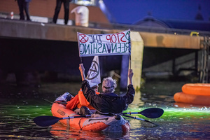 Extinction Rebellion climate activists in kayaks, attempt to block the path of Luxury Ocean liner the "Celebrity Eclipse" from docking at the Passages Terminal. A little before sunrise, climate activists from Extinction Rebellion, Netherlands attempted to block the path of Luxury Ocean liner the ‘Celebrity Eclipse’ from docking at the Passages Terminal in Amsterdam. The ‘Celebrity Eclipse’ is operated by Celebrity Cruises, a subsidiary of Royal Caribbean Group. The activist numbered 30 in all, with the majority in 2-person kayaks. ‘Cruise ships are floating environmental disasters. They should not be allowed in Dutch waters. We demand strict and binding national and international environmental standards and regulations, as well as strict enforcement and sanctions policy.