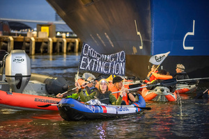 Extinction Rebellion climate activists in kayaks, attempt to block the path of Luxury Ocean liner the "Celebrity Eclipse" from docking at the Passages Terminal. A little before sunrise, climate activists from Extinction Rebellion, Netherlands attempted to block the path of Luxury Ocean liner the ‘Celebrity Eclipse’ from docking at the Passages Terminal in Amsterdam. The ‘Celebrity Eclipse’ is operated by Celebrity Cruises, a subsidiary of Royal Caribbean Group. The activists numbered 30 in all, with the majority in 2-person kayaks stating that "Cruise ships are floating environmental disasters. They should not be allowed in Dutch waters. We demand strict and binding national and international environmental standards and regulations, as well as strict enforcement and sanctions policy."