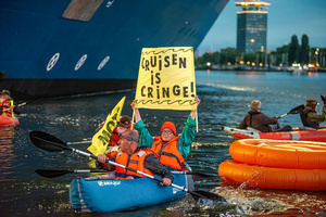 Extinction Rebellion climate activists in kayaks, attempt to block the path of Luxury Ocean liner the "Celebrity Eclipse" from docking at the Passages Terminal. A little before sunrise, climate activists from Extinction Rebellion, Netherlands attempted to block the path of Luxury Ocean liner the ‘Celebrity Eclipse’ from docking at the Passages Terminal in Amsterdam. The ‘Celebrity Eclipse’ is operated by Celebrity Cruises, a subsidiary of Royal Caribbean Group. The activists numbered 30 in all, with the majority in 2-person kayaks stating that "Cruise ships are floating environmental disasters. They should not be allowed in Dutch waters. We demand strict and binding national and international environmental standards and regulations, as well as strict enforcement and sanctions policy."