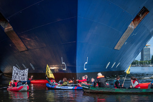 Extinction Rebellion climate activists in kayaks, attempt to block the path of Luxury Ocean liner the "Celebrity Eclipse" from docking at the Passages Terminal. A little before sunrise, climate activists from Extinction Rebellion, Netherlands attempted to block the path of Luxury Ocean liner the ‘Celebrity Eclipse’ from docking at the Passages Terminal in Amsterdam. The ‘Celebrity Eclipse’ is operated by Celebrity Cruises, a subsidiary of Royal Caribbean Group. The activists numbered 30 in all, with the majority in 2-person kayaks stating that "Cruise ships are floating environmental disasters. They should not be allowed in Dutch waters. We demand strict and binding national and international environmental standards and regulations, as well as strict enforcement and sanctions policy."