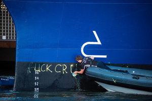 (EDITORS NOTE: Image contains profanity)
Terminal workers remove profanity from the side of the "Celebrity Eclipse" during an attempt to block the path of Luxury liner from docking at the Passages Terminal. A little before sunrise, climate activists from Extinction Rebellion, Netherlands attempted to block the path of Luxury Ocean liner the ‘Celebrity Eclipse’ from docking at the Passages Terminal in Amsterdam. The ‘Celebrity Eclipse’ is operated by Celebrity Cruises, a subsidiary of Royal Caribbean Group. The activists numbered 30 in all, with the majority in 2-person kayaks stating that "Cruise ships are floating environmental disasters. They should not be allowed in Dutch waters. We demand strict and binding national and international environmental standards and regulations, as well as strict enforcement and sanctions policy."