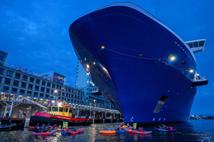 Extinction Rebellion climate activists in kayaks, attempt to block the path of Luxury Ocean liner the "Celebrity Eclipse" from docking at the Passages Terminal. A little before sunrise, climate activists from Extinction Rebellion, Netherlands attempted to block the path of Luxury Ocean liner the ‘Celebrity Eclipse’ from docking at the Passages Terminal in Amsterdam. The ‘Celebrity Eclipse’ is operated by Celebrity Cruises, a subsidiary of Royal Caribbean Group. The activists numbered 30 in all, with the majority in 2-person kayaks stating that "Cruise ships are floating environmental disasters. They should not be allowed in Dutch waters. We demand strict and binding national and international environmental standards and regulations, as well as strict enforcement and sanctions policy."