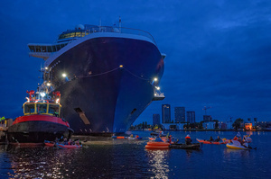 Extinction Rebellion climate activists in kayaks at pre-dawn attempt to block the path of Luxury Ocean liner the "Celebrity Eclipse" from docking at the Passages Terminal. A little before sunrise, climate activists from Extinction Rebellion, Netherlands attempted to block the path of Luxury Ocean liner the ‘Celebrity Eclipse’ from docking at the Passages Terminal in Amsterdam. The ‘Celebrity Eclipse’ is operated by Celebrity Cruises, a subsidiary of Royal Caribbean Group. The activist numbered 30 in all, with the majority in 2-person kayaks. ‘Cruise ships are floating environmental disasters. They should not be allowed in Dutch waters. We demand strict and binding national and international environmental standards and regulations, as well as strict enforcement and sanctions policy.