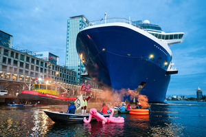 Extinction Rebellion climate activists in kayaks, attempt to block the path of Luxury Ocean liner the "Celebrity Eclipse" from docking at the Passages Terminal. A little before sunrise, climate activists from Extinction Rebellion, Netherlands attempted to block the path of Luxury Ocean liner the ‘Celebrity Eclipse’ from docking at the Passages Terminal in Amsterdam. The ‘Celebrity Eclipse’ is operated by Celebrity Cruises, a subsidiary of Royal Caribbean Group. The activists numbered 30 in all, with the majority in 2-person kayaks stating that "Cruise ships are floating environmental disasters. They should not be allowed in Dutch waters. We demand strict and binding national and international environmental standards and regulations, as well as strict enforcement and sanctions policy."