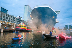 Extinction Rebellion climate activists in kayaks, attempt to block the path of Luxury Ocean liner the "Celebrity Eclipse" from docking at the Passages Terminal. A little before sunrise, climate activists from Extinction Rebellion, Netherlands attempted to block the path of Luxury Ocean liner the ‘Celebrity Eclipse’ from docking at the Passages Terminal in Amsterdam. The ‘Celebrity Eclipse’ is operated by Celebrity Cruises, a subsidiary of Royal Caribbean Group. The activist numbered 30 in all, with the majority in 2-person kayaks. ‘Cruise ships are floating environmental disasters. They should not be allowed in Dutch waters. We demand strict and binding national and international environmental standards and regulations, as well as strict enforcement and sanctions policy.