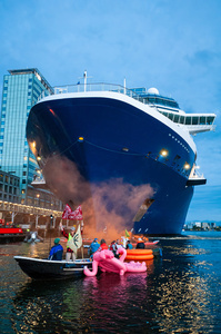 Extinction Rebellion climate activists in kayaks, attempt to block the path of Luxury Ocean liner the "Celebrity Eclipse" from docking at the Passages Terminal. A little before sunrise, climate activists from Extinction Rebellion, Netherlands attempted to block the path of Luxury Ocean liner the ‘Celebrity Eclipse’ from docking at the Passages Terminal in Amsterdam. The ‘Celebrity Eclipse’ is operated by Celebrity Cruises, a subsidiary of Royal Caribbean Group. The activists numbered 30 in all, with the majority in 2-person kayaks stating that "Cruise ships are floating environmental disasters. They should not be allowed in Dutch waters. We demand strict and binding national and international environmental standards and regulations, as well as strict enforcement and sanctions policy."