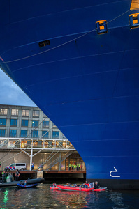 Extinction Rebellion climate activists in kayaks, attempt to block the path of Luxury Ocean liner the "Celebrity Eclipse" from docking at the Passages Terminal. A little before sunrise, climate activists from Extinction Rebellion, Netherlands attempted to block the path of Luxury Ocean liner the ‘Celebrity Eclipse’ from docking at the Passages Terminal in Amsterdam. The ‘Celebrity Eclipse’ is operated by Celebrity Cruises, a subsidiary of Royal Caribbean Group. The activist numbered 30 in all, with the majority in 2-person kayaks. ‘Cruise ships are floating environmental disasters. They should not be allowed in Dutch waters. We demand strict and binding national and international environmental standards and regulations, as well as strict enforcement and sanctions policy.