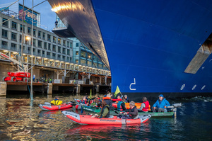 Extinction Rebellion climate activists in kayaks, attempt to block the path of Luxury Ocean liner the "Celebrity Eclipse" from docking at the Passages Terminal. A little before sunrise, climate activists from Extinction Rebellion, Netherlands attempted to block the path of Luxury Ocean liner the ‘Celebrity Eclipse’ from docking at the Passages Terminal in Amsterdam. The ‘Celebrity Eclipse’ is operated by Celebrity Cruises, a subsidiary of Royal Caribbean Group. The activists numbered 30 in all, with the majority in 2-person kayaks stating that "Cruise ships are floating environmental disasters. They should not be allowed in Dutch waters. We demand strict and binding national and international environmental standards and regulations, as well as strict enforcement and sanctions policy."
