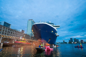 Extinction Rebellion climate activists in kayaks, attempt to block the path of Luxury Ocean liner the "Celebrity Eclipse" from docking at the Passages Terminal. A little before sunrise, climate activists from Extinction Rebellion, Netherlands attempted to block the path of Luxury Ocean liner the ‘Celebrity Eclipse’ from docking at the Passages Terminal in Amsterdam. The ‘Celebrity Eclipse’ is operated by Celebrity Cruises, a subsidiary of Royal Caribbean Group. The activist numbered 30 in all, with the majority in 2-person kayaks. ‘Cruise ships are floating environmental disasters. They should not be allowed in Dutch waters. We demand strict and binding national and international environmental standards and regulations, as well as strict enforcement and sanctions policy.