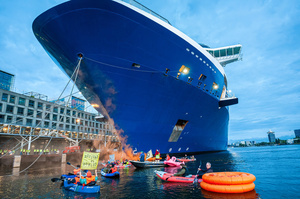 Extinction Rebellion climate activists in kayaks, attempt to block the path of Luxury Ocean liner the "Celebrity Eclipse" from docking at the Passages Terminal. A little before sunrise, climate activists from Extinction Rebellion, Netherlands attempted to block the path of Luxury Ocean liner the ‘Celebrity Eclipse’ from docking at the Passages Terminal in Amsterdam. The ‘Celebrity Eclipse’ is operated by Celebrity Cruises, a subsidiary of Royal Caribbean Group. The activists numbered 30 in all, with the majority in 2-person kayaks stating that "Cruise ships are floating environmental disasters. They should not be allowed in Dutch waters. We demand strict and binding national and international environmental standards and regulations, as well as strict enforcement and sanctions policy."