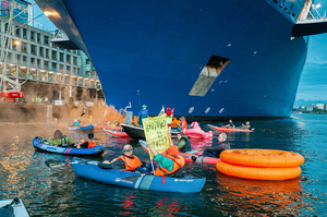 Extinction Rebellion climate activists in kayaks, attempt to block the path of Luxury Ocean liner the "Celebrity Eclipse" from docking at the Passages Terminal. A little before sunrise, climate activists from Extinction Rebellion, Netherlands attempted to block the path of Luxury Ocean liner the ‘Celebrity Eclipse’ from docking at the Passages Terminal in Amsterdam. The ‘Celebrity Eclipse’ is operated by Celebrity Cruises, a subsidiary of Royal Caribbean Group. The activists numbered 30 in all, with the majority in 2-person kayaks stating that "Cruise ships are floating environmental disasters. They should not be allowed in Dutch waters. We demand strict and binding national and international environmental standards and regulations, as well as strict enforcement and sanctions policy."