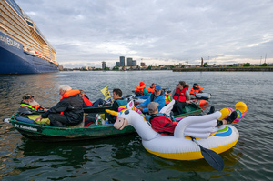 An Extinction Rebellion activists seen floating on a unicorn, during an attempt to block the path of Luxury Ocean liner the "Celebrity Eclipse" from docking at the Passages Terminal. A little before sunrise, climate activists from Extinction Rebellion, Netherlands attempted to block the path of Luxury Ocean liner the ‘Celebrity Eclipse’ from docking at the Passages Terminal in Amsterdam. The ‘Celebrity Eclipse’ is operated by Celebrity Cruises, a subsidiary of Royal Caribbean Group. The activists numbered 30 in all, with the majority in 2-person kayaks stating that "Cruise ships are floating environmental disasters. They should not be allowed in Dutch waters. We demand strict and binding national and international environmental standards and regulations, as well as strict enforcement and sanctions policy."