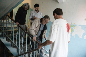 Young men assisted the elderly residents in evacuating from the residential building following the Russian missile attack. On July 31, 2025, a massive Russian missile and drone attack on Kyiv left at least 16 people dead, including two children, and caused widespread destruction. Ukrainian forces intercepted most of the 309 drones and eight cruise missiles, but some struck residential areas, collapsing a section of a nine-story building. Over 100 buildings were damaged across 27 locations, including schools, hospitals, and homes.
