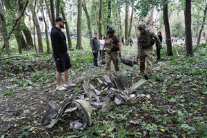 Ukrainian armed forces check the debris of a missile following the Russian missile attack. On July 31, 2025, a massive Russian missile and drone attack on Kyiv left at least 16 people dead, including two children, and caused widespread destruction. Ukrainian forces intercepted most of the 309 drones and eight cruise missiles, but some struck residential areas, collapsing a section of a nine-story building. Over 100 buildings were damaged across 27 locations, including schools, hospitals, and homes.
