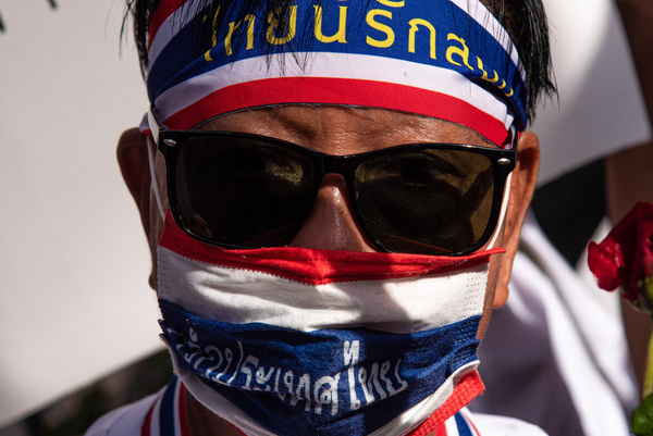 A member of Thai royalist group seen wearing a headband and facemask with the Thai flag during the gathering in front of the Royal Thai Army Headquarters. The Thai royalist group gathered in front of the Royal Thai Army Headquarters to show their support to the Thai army after the 5 days clash between Thai and Cambodian troops following the Thailand-Cambodia border dispute. The leaders of Thailand and Cambodia agreed to a ceasefire effective in the midnight of July 28 2025.