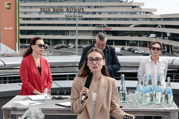 Liusiena Zinovkina, the wife of Ukrainian civilian prisoner Konstantyn Zinovkin who remains in Russian captivity speaks at the press conference . The act was part of a commemorative event marking the one-year anniversary of the largest political prisoner exchange since Soviet times. The event took place at the MOXY Cologne Bonn Airport hotel. It brought together several former detainees including human rights advocate Oleg Orlov, politician Andrei Pivovarov, activists Vadim Ostanin, Demuri Voronin, Herman Moises and Kevin Lick. Other speakers included Belarusian human rights defender Leanid Sudalenka, a former political prisoner and Liusiena Zinovkina whose husband is a Ukrainian civilian detainee. Participants signed an open appeal to world leaders urging them to act in support of political prisoners and ensure their release. The gathering served as a public reminder of those who remain behind bars and the need for continued international pressure.