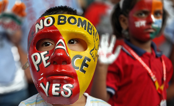 A boy wearing a mask with words 'No Bomb Peace Yes' is seen during the Hiroshima-Nagasaki Day annual peace rally. Hiroshima-Nagasaki Day annual peace rally was organised by students from different colleges of the city to commemorate 80th anniversary of the devastating atomic attacks on Hiroshima and Nagasaki by America during World War II. Students graphically depicted horrors of nuclear war aimed to raise awareness about catastrophic consequences of nuclear weapons and reaffirm collective commitment to peace and non-violence.