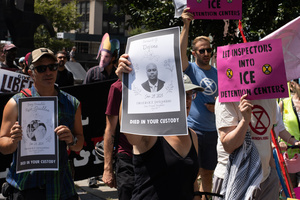 People hold signs during the demonstration. Demonstrators of the group "Extinction Rebellion" protest outside of the Immigration Court at 26 Federal Plaza against ICE detainments and inhumane holding conditions.