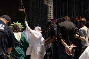 Demonstrators of the group "Extinction Rebellion" protest outside of the Immigration Court. Demonstrators of the group "Extinction Rebellion" protest outside of the Immigration Court at 26 Federal Plaza against ICE detainments and inhumane holding conditions.