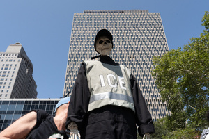 A skeleton seen wearing a vest with "ICE" written on it. Demonstrators of the group "Extinction Rebellion" protest outside of the Immigration Court at 26 Federal Plaza against ICE detainments and inhumane holding conditions.