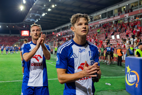 Krystian Pomorski (L) and Bartosz Borowski (R) of Wisla applaud during the Polish PKO Ekstraklasa League match between Widzew Lodz and Wisla Plock at Widzew Lodz Municipal Stadium. Final score; Widzew Lodz 1:1 Wisla Plock.