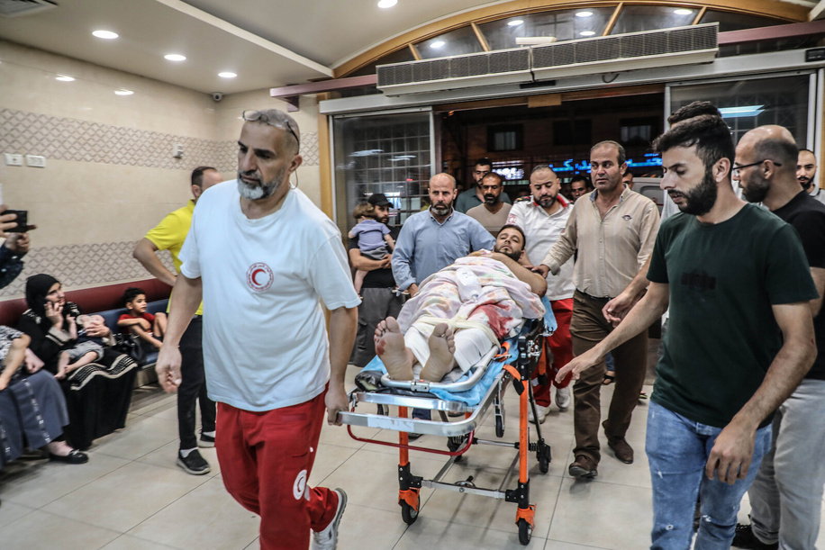 A Palestinian who was injured during the clashes with Jewish settlers near the town of Aqraba, south of Nablus, in the northern West Bank is being brought for treatment at a hospital . One Palestinian was killed and others were injured during the clashes.