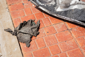 A charred piece of fabric belonging to Phing, one of the seven victims killed in the July 24 rocket strike on a PTT station in Kantharalak during the Thai-Cambodian border clash. Three weeks after the Cambodian border clash, Kantharalak still bears the scars, including the July 24 rocket strike on a PTT station that killed eight civilians and injured several others. The station remains closed, leaving more than 50 employees in limbo as compensation issues remain unresolved.