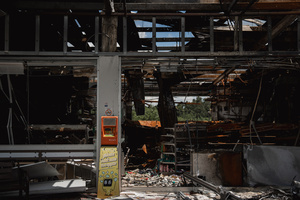 The charred interior of the 7-Eleven at a PTT station in Kantharalak, left in ruins weeks after a rocket strike during the Thai-Cambodian border clash. Three weeks after the Cambodian border clash, Kantharalak still bears the scars, including the July 24 rocket strike on a PTT station that killed eight civilians and injured several others. The station remains closed, leaving more than 50 employees in limbo as compensation issues remain unresolved.