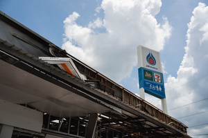 The burnt facade of the 7-Eleven at a PTT station in Kantharalak, weeks after a rocket strike during the Thai-Cambodian border clash. Three weeks after the Cambodian border clash, Kantharalak still bears the scars, including the July 24 rocket strike on a PTT station that killed eight civilians and injured several others. The station remains closed, leaving more than 50 employees in limbo as compensation issues remain unresolved.