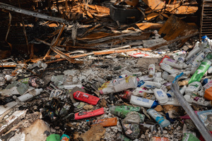 Burnt and melted toiletries were scattered among debris inside the destroyed 7-Eleven at a PTT station in Kantharalak, weeks after a rocket strike during the Thai-Cambodian border clash. Three weeks after the Cambodian border clash, Kantharalak still bears the scars, including the July 24 rocket strike on a PTT station that killed eight civilians and injured several others. The station remains closed, leaving more than 50 employees in limbo as compensation issues remain unresolved.