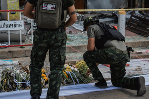 Thai Army soldiers lay flowers in front of the destroyed 7-Eleven at a PTT station in Kantharalak, honoring the victims of the July 24 rocket strike during the Thai-Cambodian border clash. Three weeks after the Cambodian border clash, Kantharalak still bears the scars, including the July 24 rocket strike on a PTT station that killed eight civilians and injured several others. The station remains closed, leaving more than 50 employees in limbo as compensation issues remain unresolved.