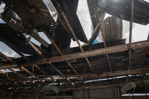 The burnt and partially collapsed roof of the 7-Eleven at a PTT station in Kantharalak, weeks after a rocket strike during the Thai-Cambodian border clash. Three weeks after the Cambodian border clash, Kantharalak still bears the scars, including the July 24 rocket strike on a PTT station that killed eight civilians and injured several others. The station remains closed, leaving more than 50 employees in limbo as compensation issues remain unresolved.