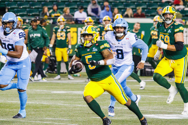 Edmonton Elks (5) Justin Rankin seen in action with Toronto Argonaut's (8) Cameron Judge during CFL regular Season at Commonwealth Stadium. Final score Edmonton Elks (3-7) : Toronto Argonauts (2-8)