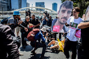 Israeli police officers seen arresting a protester during a demonstration. Demonstrators call on Israeli Prime Minister Benjamin Netanyahu to end the war in Gaza and to release all 50 Israeli hostages held by Hamas since October 7, 2023. On what was the biggest day of national mobilization, hundreds of thousands of people poured into the streets around the country to demand a Hostage release deal and an end to the war in Gaza.