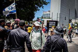 Protestors are pushed back by police officers during a demonstration. Demonstrators call on Israeli Prime Minister Benjamin Netanyahu to end the war in Gaza and to release all 50 Israeli hostages held by Hamas since October 7, 2023. On what was the biggest day of national mobilization, hundreds of thousands of people poured into the streets around the country to demand a Hostage release deal and an end to the war in Gaza.