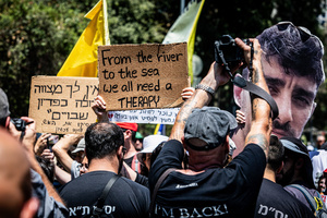 Israeli protestors hold up placards during a demonstration. Demonstrators call on Israeli Prime Minister Benjamin Netanyahu to end the war in Gaza and to release all 50 Israeli hostages held by Hamas since October 7, 2023. On what was the biggest day of national mobilization, hundreds of thousands of people poured into the streets around the country to demand a Hostage release deal and an end to the war in Gaza.