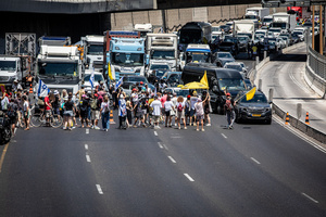 Protesters block the Ayalon Highway during a demonstration. Demonstrators call on Israeli Prime Minister Benjamin Netanyahu to end the war in Gaza and to release all 50 Israeli hostages held by Hamas since October 7, 2023. On what was the biggest day of national mobilization, hundreds of thousands of people poured into the streets around the country to demand a Hostage release deal and an end to the war in Gaza.