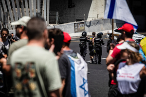 Police officers detain a protester during a demonstration. Demonstrators call on Israeli Prime Minister Benjamin Netanyahu to end the war in Gaza and to release all 50 Israeli hostages held by Hamas since October 7, 2023. On what was the biggest day of national mobilization, hundreds of thousands of people poured into the streets around the country to demand a Hostage release deal and an end to the war in Gaza.
