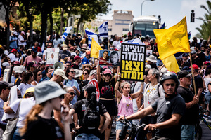 Israeli protestors hold up a sign that reads in Hebrew “ Get them out of Gaza, and Exit Gaza” during a demonstration. Demonstrators call on Israeli Prime Minister Benjamin Netanyahu to end the war in Gaza and to release all 50 Israeli hostages held by Hamas since October 7, 2023. On what was the biggest day of national mobilization, hundreds of thousands of people poured into the streets around the country to demand a Hostage release deal and an end to the war in Gaza.