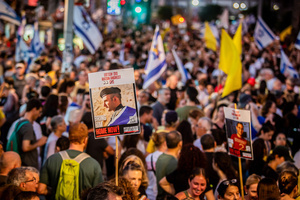 A placard showing a photo of Israeli hostage Matan Angrest seen during a demonstration. Demonstrators call on Israeli Prime Minister Benjamin Netanyahu to end the war in Gaza and to release all 50 Israeli hostages held by Hamas since October 7, 2023. On what was the biggest day of national mobilization, hundreds of thousands of people poured into the streets around the country to demand a Hostage release deal and an end to the war in Gaza.