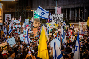 People carry placards with images of Israeli hostages and Israeli flags during the demonstration. Demonstrators call on Israeli Prime Minister Benjamin Netanyahu to end the war in Gaza and to release all 50 Israeli hostages held by Hamas since October 7, 2023. On what was the biggest day of national mobilization, hundreds of thousands of people poured into the streets around the country to demand a Hostage release deal and an end to the war in Gaza.