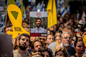 Protesters hold up signs and a placard of Bipin Joshi, who is held hostage by Hamas during the demonstration. Demonstrators call on Israeli Prime Minister Benjamin Netanyahu to end the war in Gaza and to release all 50 Israeli hostages held by Hamas since October 7, 2023. On what was the biggest day of national mobilization, hundreds of thousands of people poured into the streets around the country to demand a Hostage release deal and an end to the war in Gaza.