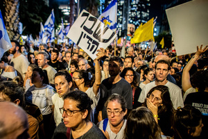 An Israeli woman holds up a sign that reads in Hebrew “We Had Enough “ during a demonstration. Demonstrators call on Israeli Prime Minister Benjamin Netanyahu to end the war in Gaza and to release all 50 Israeli hostages held by Hamas since October 7, 2023. On what was the biggest day of national mobilization, hundreds of thousands of people poured into the streets around the country to demand a Hostage release deal and an end to the war in Gaza.