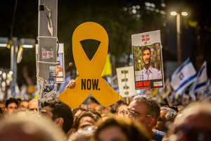 Protesters hold up signs and a placard of Bipin Joshi, who is held hostage by Hamas during the demonstration. Demonstrators call on Israeli Prime Minister Benjamin Netanyahu to end the war in Gaza and to release all 50 Israeli hostages held by Hamas since October 7, 2023. On what was the biggest day of national mobilization, hundreds of thousands of people poured into the streets around the country to demand a Hostage release deal and an end to the war in Gaza.