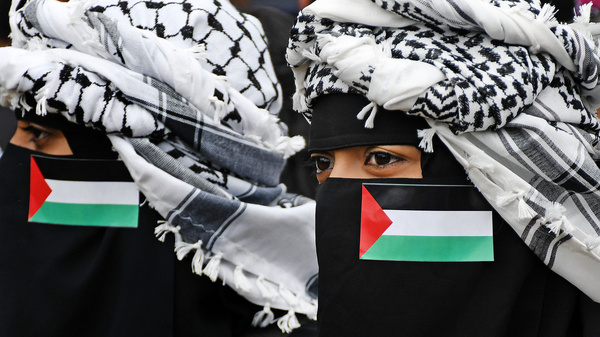 Muslim women wearing hijabs with Palestine stickers seen during the Palestine solidarity gathering in Mumbai. People held a peaceful protest to condemn the violence and atrocities against Palestine by Israel military and termed it as genocide.