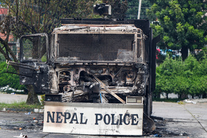 A burnt police vehicle is pictured inside the Federal Parliament after the Gen Z protests in Kathmandu, Nepal, on Wednesday, September 10, 2025, the third day of an army-imposed curfew. The demonstrations, sparked by anger over corruption, the social media ban, and the killing of more than 19 youths, led to the resignation of Prime Minister K.P. Sharma Oli. The country remains under army control amid escalating unrest.